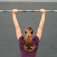 Why Do Women Tighten Their Ponytails Before a Heavy Lift?