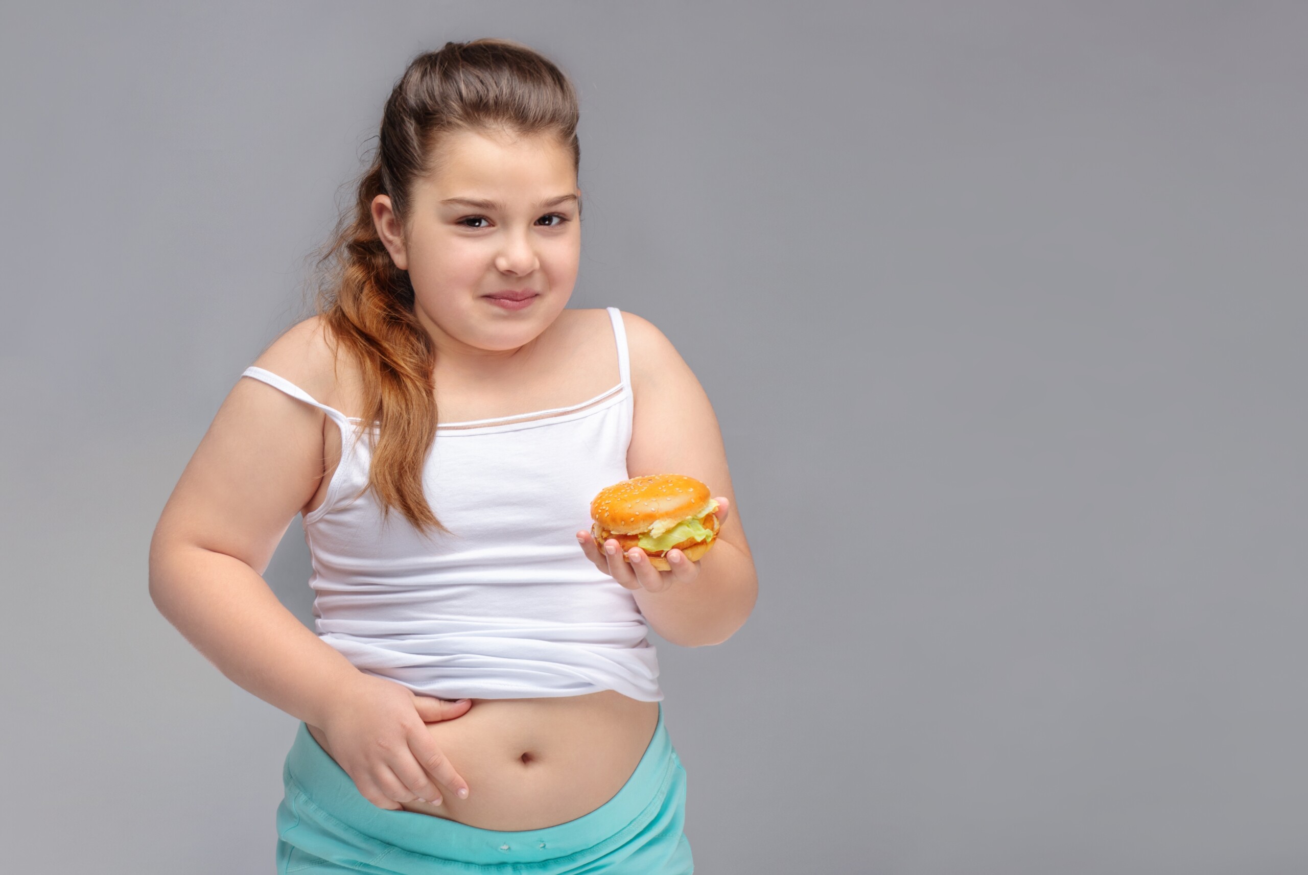 Plus Size Mom Teaches Obese Child to “Booo!” Diet Commercials